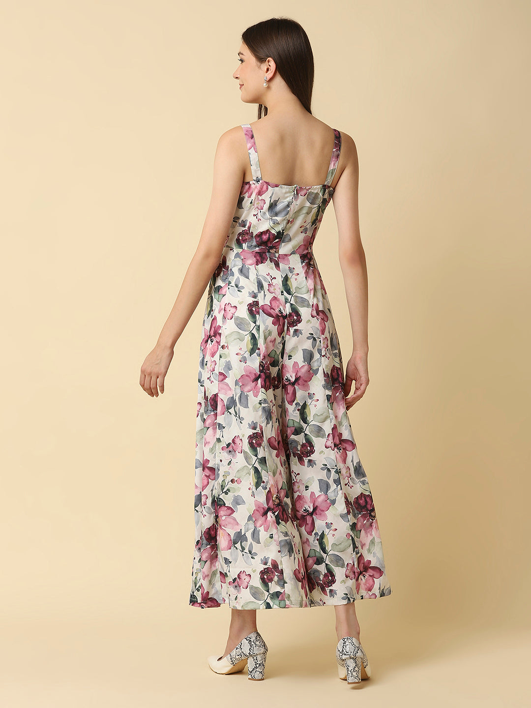A fit and flare women floral jumpsuit with a waist cut is a stylish and trendy outfit that features a fitted bodice and a flared bottom. The waist cut creates a defined waistline, highlighting the curves of the body.
