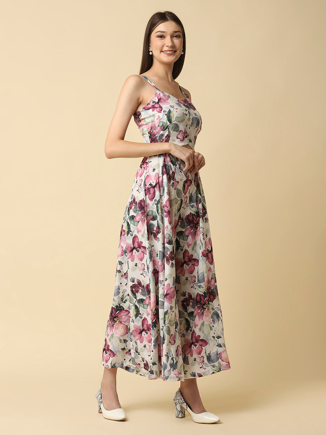 A fit and flare women floral jumpsuit with a waist cut is a stylish and trendy outfit that features a fitted bodice and a flared bottom. The waist cut creates a defined waistline, highlighting the curves of the body.