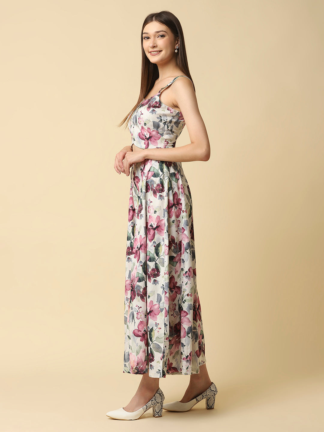 A fit and flare women floral jumpsuit with a waist cut is a stylish and trendy outfit that features a fitted bodice and a flared bottom. The waist cut creates a defined waistline, highlighting the curves of the body.