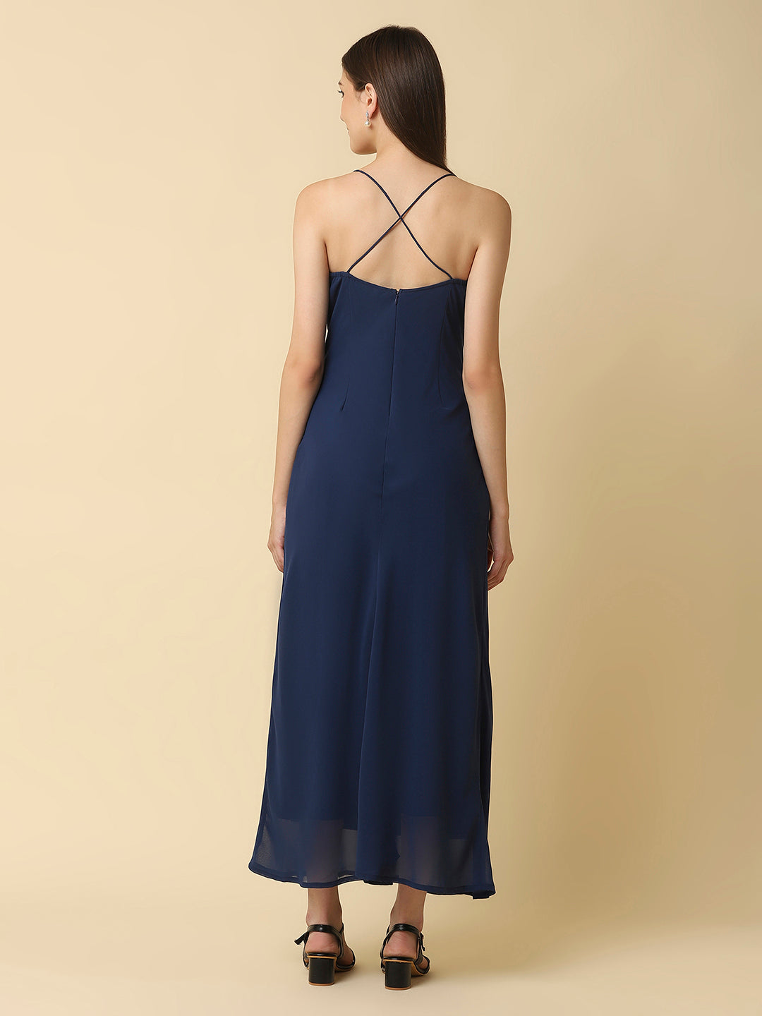 This solid maxi dress features a ruched bust and noodle straps, making it a perfect summer staple. The ruched bust adds a touch of femininity and the noodle straps ensure a comfortable fit. The maxi length makes it great for formal or casual occasions.