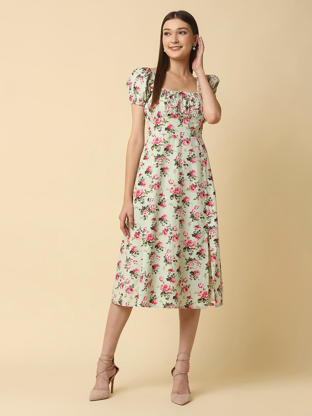 This green floral Printed Women Dress In Cotton is a charming and elegant piece that is sure to catch the eye. Made from soft and breathable cotton fabric, it is perfect for warm weather and will keep you comfortable all day long. The dress features a beautiful floral print in shades of pink, white, and green that adds a pop of color to your wardrobe.  The ruched bust and empire waist create a flattering silhouette that accentuates your curves and adds a feminine touch to the dress. 