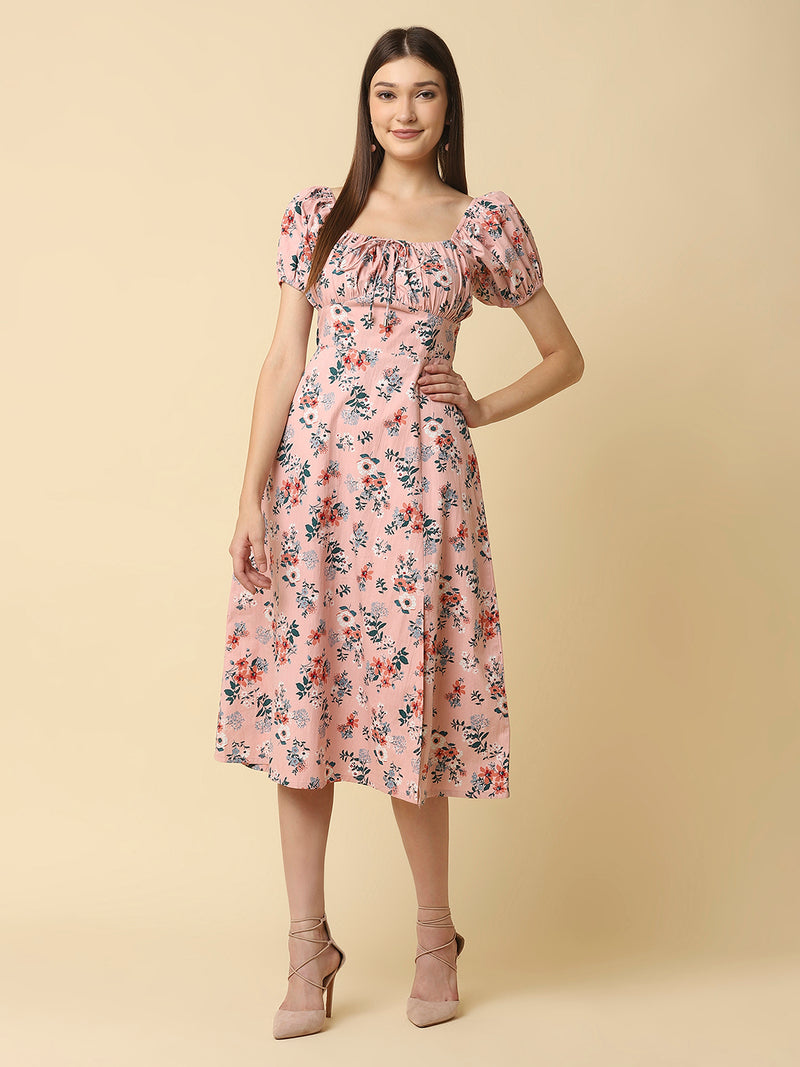 This Pink Floral Printed Women Dress In Cotton is a charming and elegant piece that is sure to catch the eye. Made from soft and breathable cotton fabric, it is perfect for warm weather and will keep you comfortable all day long. The dress features a beautiful floral print in shades of pink, white, and green that adds a pop of color to your wardrobe.