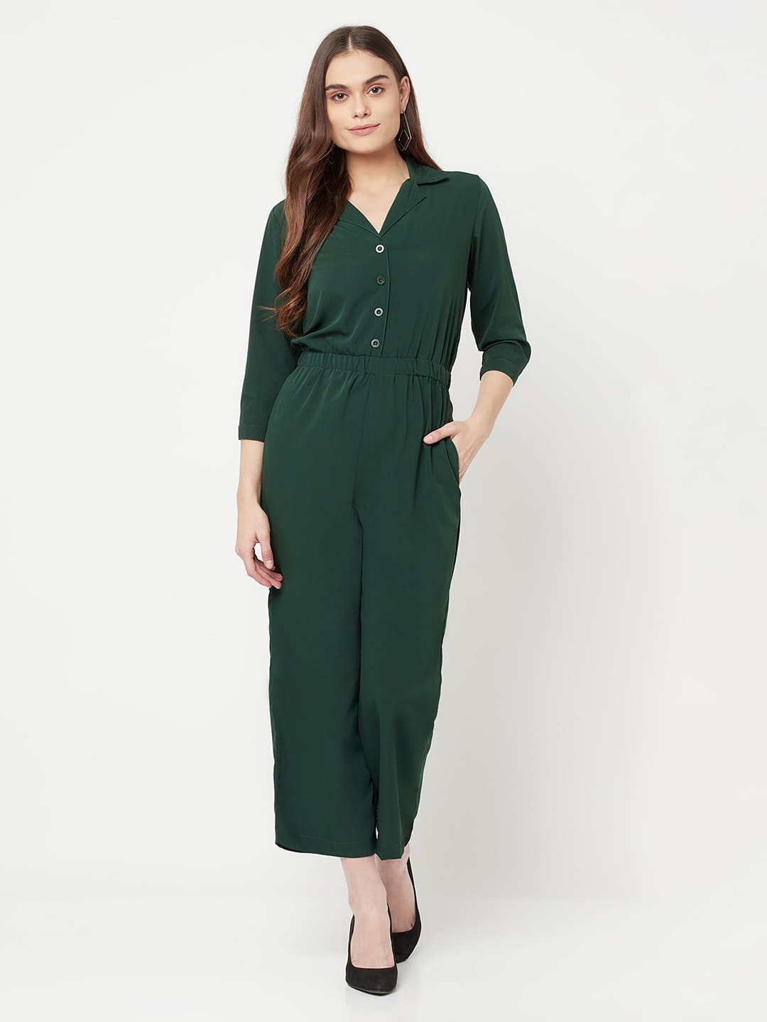 This Green color solid jump suit for women with an elasticated waist is a versatile and stylish piece of clothing that can be dressed up or down for any occasion. It is made of a comfortable and stretchy material that allows for ease of movement, while the elasticated waistband helps to flatter the figure and create a flattering silhouette.