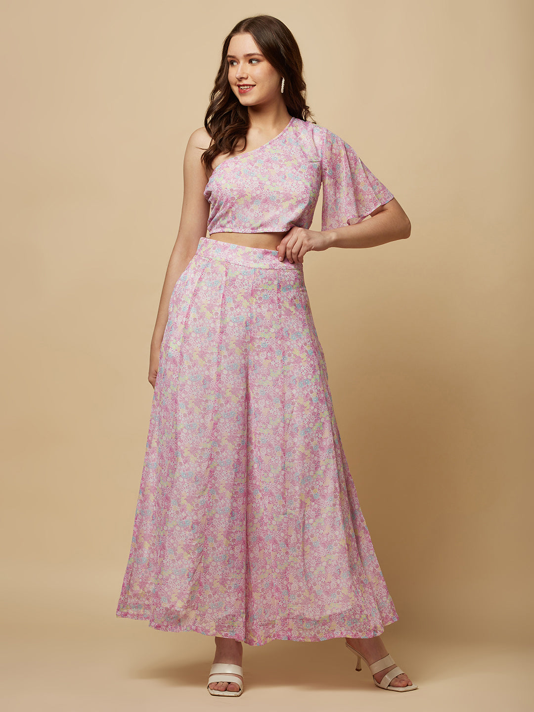This fashionable co-ord set features a stunning purple floral print, making it the perfect addition to any fashion-forward woman's wardrobe. The set includes a trendy one-shoulder crop top and a pair of flowing palazzo pants.  The top is designed with a single shoulder strap, which adds an edgy and modern touch to the overall look. It also features a fitted bodice, which flatters the silhouette and accentuates the curves.