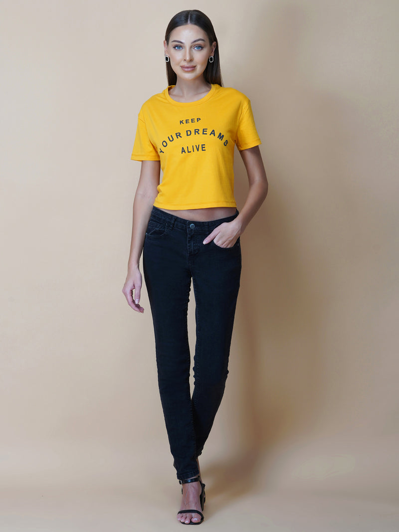 This women's t-shirt features a vibrant yellow color, making it perfect for adding a pop of brightness to any outfit. The T-shirt is made from a soft, comfortable fabric that is perfect for everyday wear. The design features a classic round neckline and short sleeves, making it ideal for warmer weather.