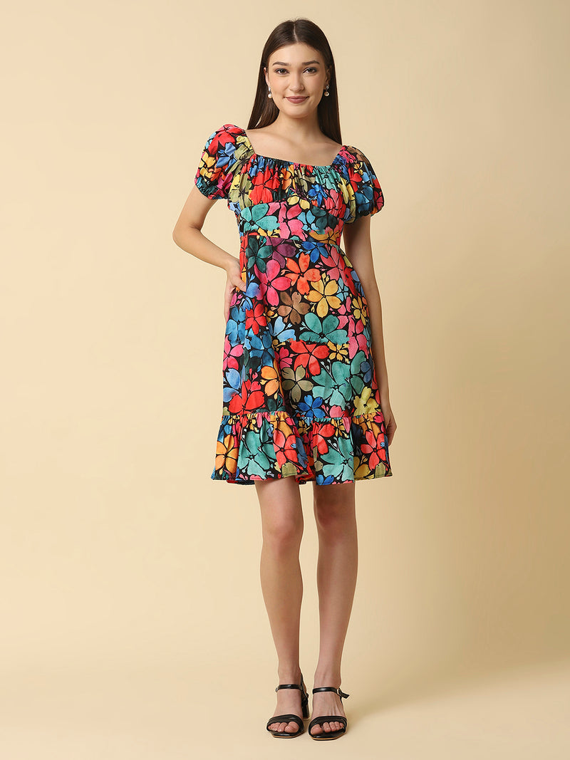 A floral printed empire waist short dress with gathered sleeves is a stylish and feminine dress that would be perfect for a variety of occasions. The empire waist style of the dress is defined by a high waistline that sits just below the bust, giving the dress a flowy and relaxed fit.
