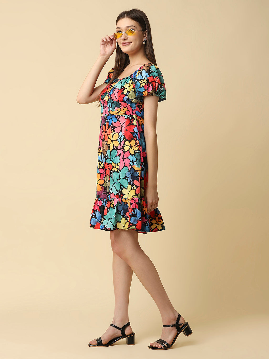 A floral printed empire waist short dress with gathered sleeves is a stylish and feminine dress that would be perfect for a variety of occasions. The empire waist style of the dress is defined by a high waistline that sits just below the bust, giving the dress a flowy and relaxed fit.