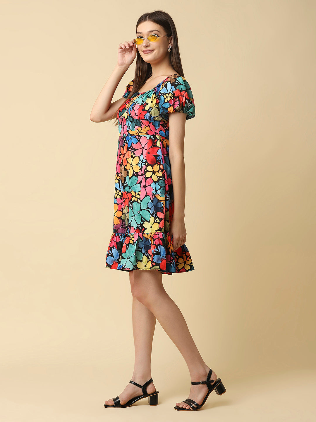 A floral printed empire waist short dress with gathered sleeves is a stylish and feminine dress that would be perfect for a variety of occasions. The empire waist style of the dress is defined by a high waistline that sits just below the bust, giving the dress a flowy and relaxed fit.