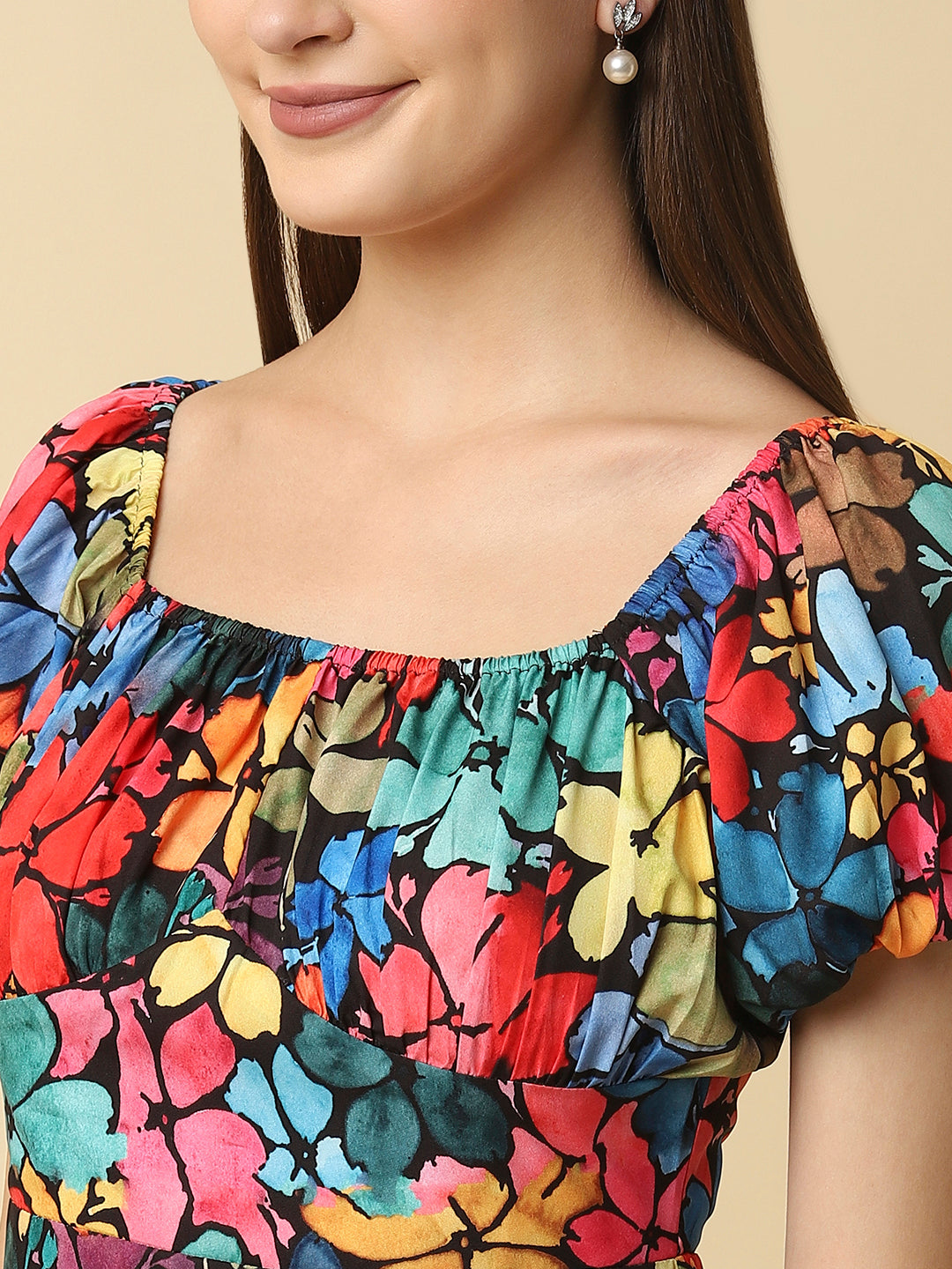 A floral printed empire waist short dress with gathered sleeves is a stylish and feminine dress that would be perfect for a variety of occasions. The empire waist style of the dress is defined by a high waistline that sits just below the bust, giving the dress a flowy and relaxed fit.