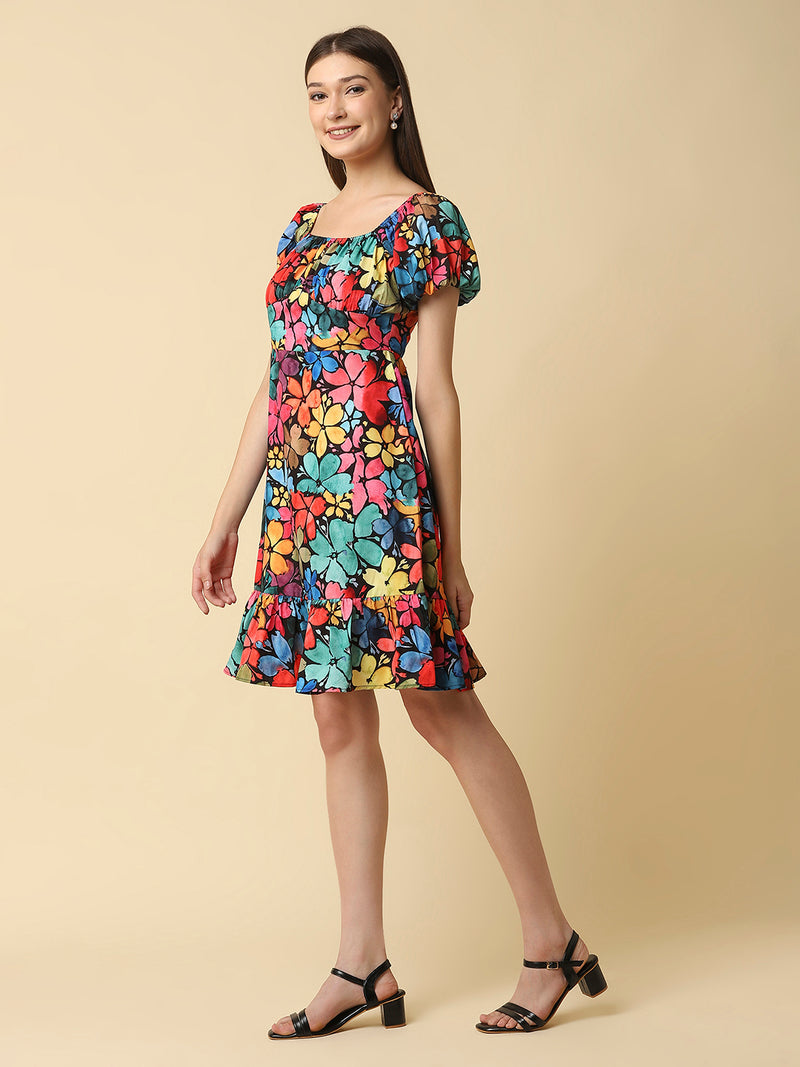 A floral printed empire waist short dress with gathered sleeves is a stylish and feminine dress that would be perfect for a variety of occasions. The empire waist style of the dress is defined by a high waistline that sits just below the bust, giving the dress a flowy and relaxed fit.