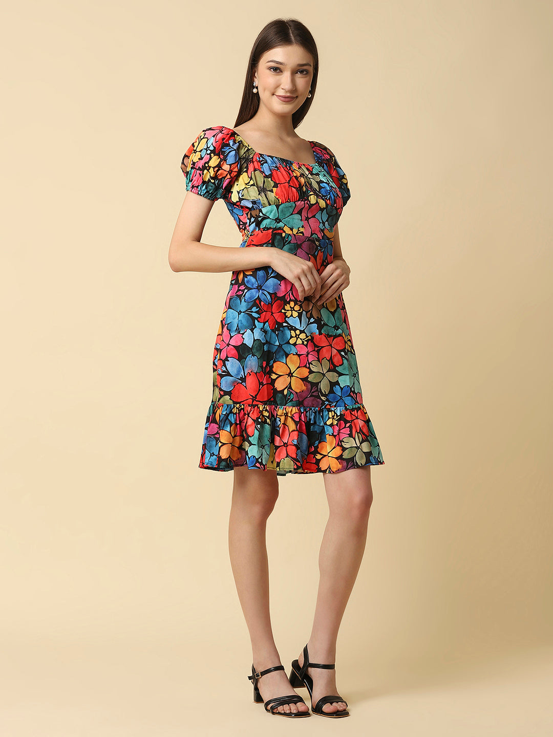 A floral printed empire waist short dress with gathered sleeves is a stylish and feminine dress that would be perfect for a variety of occasions. The empire waist style of the dress is defined by a high waistline that sits just below the bust, giving the dress a flowy and relaxed fit.