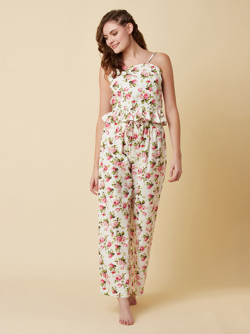 A floral printed cotton night suit for women is a comfortable and stylish sleepwear option that features a soft, breathable cotton fabric and a beautiful floral print design. This night suit for women consists of a relaxed fit style matching set of a top and bottom.  The cotton fabric used in the night suit is highly absorbent, which means it can effectively absorb sweat and keep you feeling fresh and cool throughout the night.