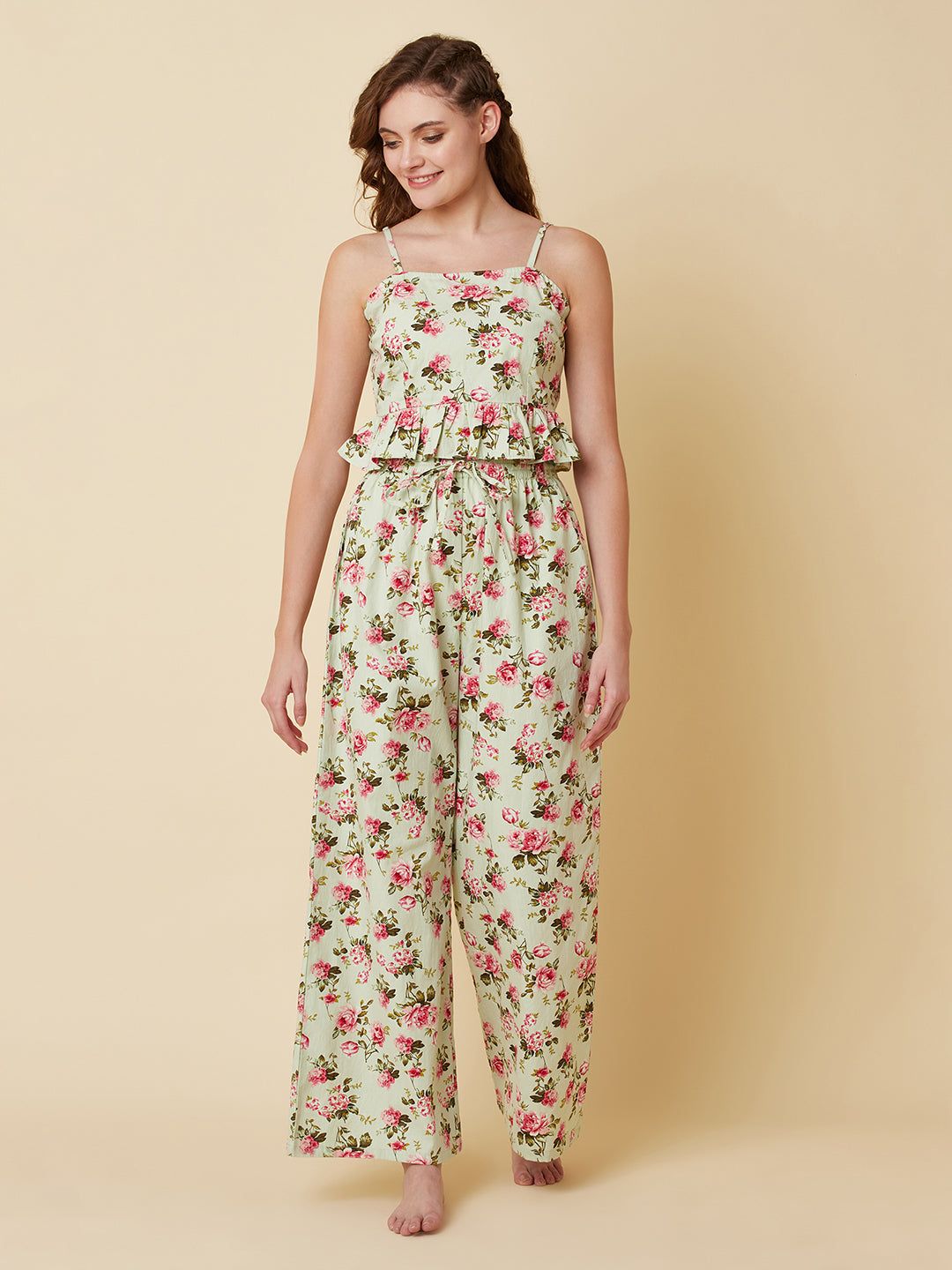 Green floral printed cotton night suit for women is a comfortable and stylish sleepwear option that features a soft, breathable cotton fabric and a beautiful floral print design. Typically, a cotton night suit for women consists of a matching set of a top and bottom, usually in a relaxed fit style for maximum comfort.  The cotton fabric used in the night suit is highly absorbent, which means it can effectively absorb sweat and keep you feeling fresh and cool throughout the night.