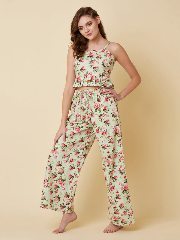 Green floral printed cotton night suit for women is a comfortable and stylish sleepwear option that features a soft, breathable cotton fabric and a beautiful floral print design. Typically, a cotton night suit for women consists of a matching set of a top and bottom, usually in a relaxed fit style for maximum comfort.  The cotton fabric used in the night suit is highly absorbent, which means it can effectively absorb sweat and keep you feeling fresh and cool throughout the night.