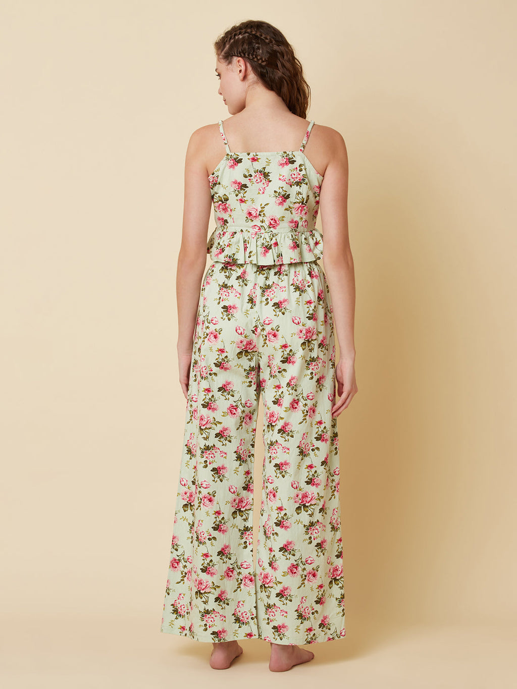 Green floral printed cotton night suit for women is a comfortable and stylish sleepwear option that features a soft, breathable cotton fabric and a beautiful floral print design. Typically, a cotton night suit for women consists of a matching set of a top and bottom, usually in a relaxed fit style for maximum comfort.  The cotton fabric used in the night suit is highly absorbent, which means it can effectively absorb sweat and keep you feeling fresh and cool throughout the night.