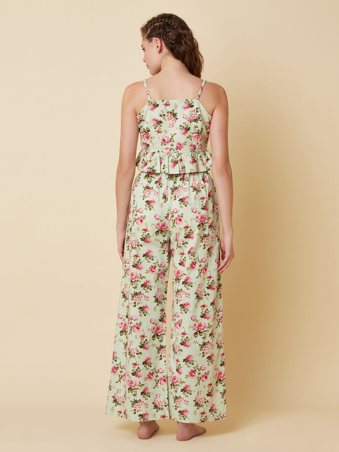 Green floral printed cotton night suit for women is a comfortable and stylish sleepwear option that features a soft, breathable cotton fabric and a beautiful floral print design. Typically, a cotton night suit for women consists of a matching set of a top and bottom, usually in a relaxed fit style for maximum comfort.  The cotton fabric used in the night suit is highly absorbent, which means it can effectively absorb sweat and keep you feeling fresh and cool throughout the night.