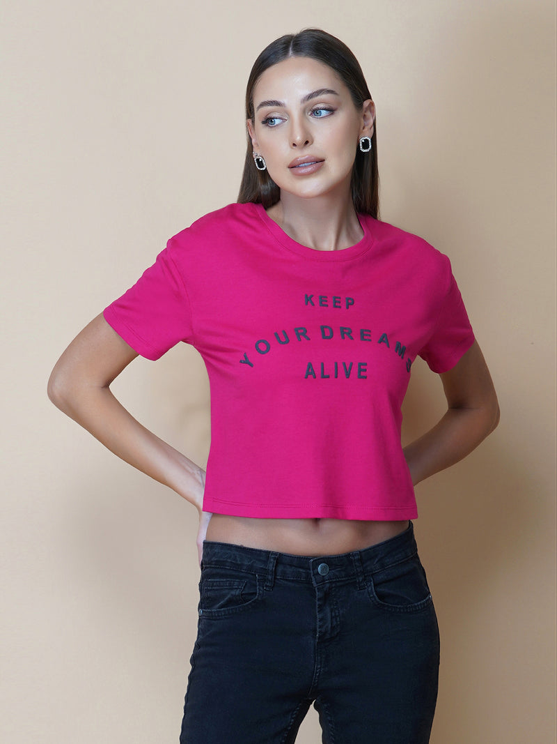 A quote T-shirt for women in pink color is the perfect addition to any fashion-conscious woman's wardrobe. Made from soft and comfortable fabric, this T-shirt is designed to provide a relaxed fit and a comfortable feel. The pink color of the shirt adds a touch of feminine charm to the overall look, making it an ideal choice for those who love to express their femininity in a subtle yet stylish way.