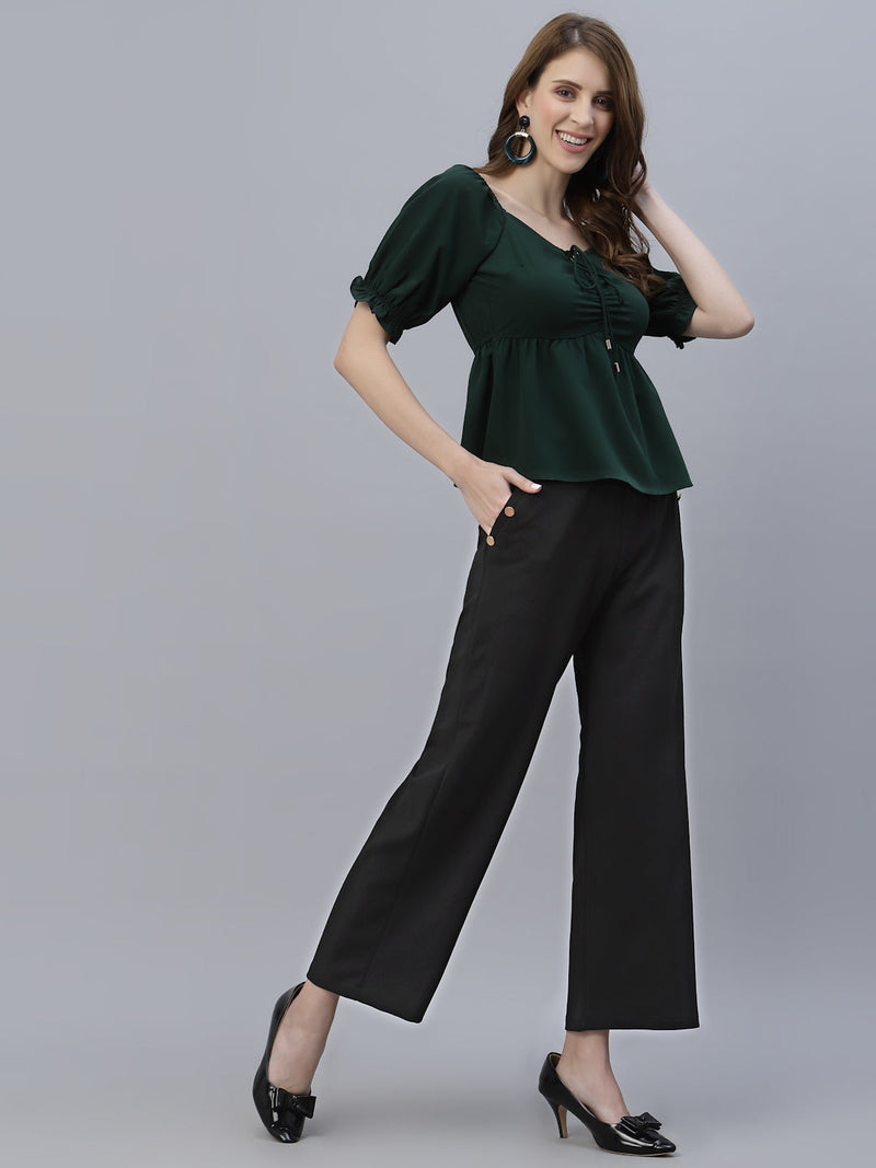 A Green Solid Ruched Waist Peplum Top for Women is a stylish and flattering garment that is perfect for various occasions. The top features a beautiful shade of green, which is perfect for adding a pop of color to any outfit. The ruched waistline creates a slimming effect, accentuating the natural curves of the body. The peplum detail adds a feminine and stylish touch to the design, making it perfect for a night out or a formal event.