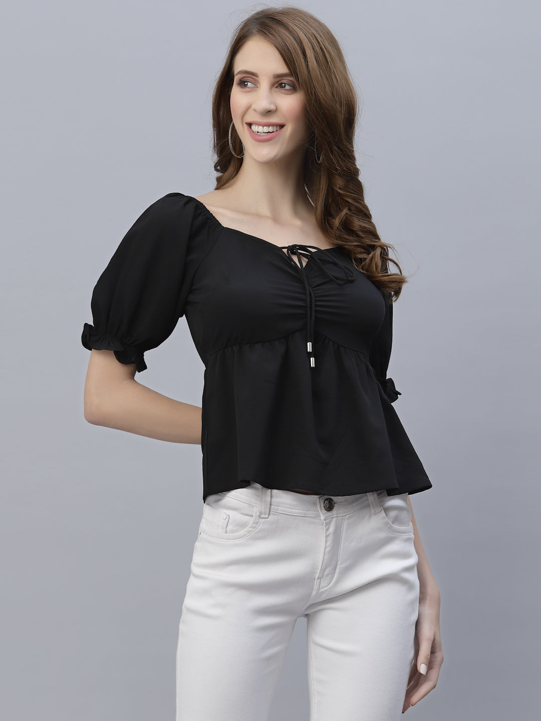 A Green Solid Ruched Waist Peplum Top for Women is a stylish and flattering garment that is perfect for various occasions. The top features a beautiful shade of green, which is perfect for adding a pop of color to any outfit. The ruched waistline creates a slimming effect, accentuating the natural curves of the body. The peplum detail adds a feminine and stylish touch to the design, making it perfect for a night out or a formal event.