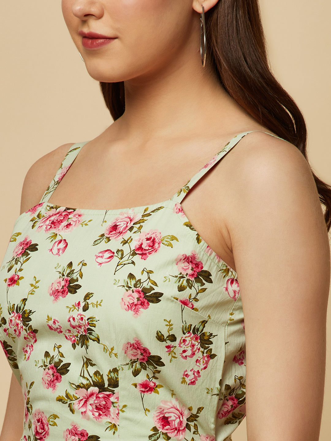 Introducing our Green Floral Printed Cotton Jumpsuit, the perfect addition to your wardrobe for any occasion! This stunning jumpsuit is crafted from high-quality cotton fabric, ensuring both comfort and durability. The eye-catching green floral print is perfect for adding a touch of spring to any outfit.  The back of the jumpsuit features a drawstring, allowing you to adjust the fit to your liking. 