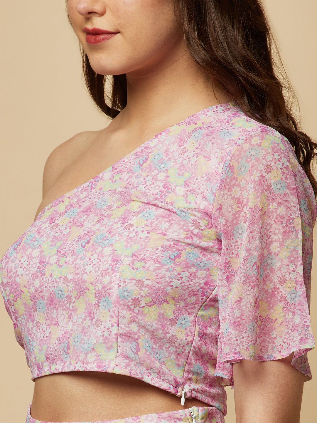 This fashionable co-ord set features a stunning purple floral print, making it the perfect addition to any fashion-forward woman's wardrobe. The set includes a trendy one-shoulder crop top and a pair of flowing palazzo pants.  The top is designed with a single shoulder strap, which adds an edgy and modern touch to the overall look. It also features a fitted bodice, which flatters the silhouette and accentuates the curves.
