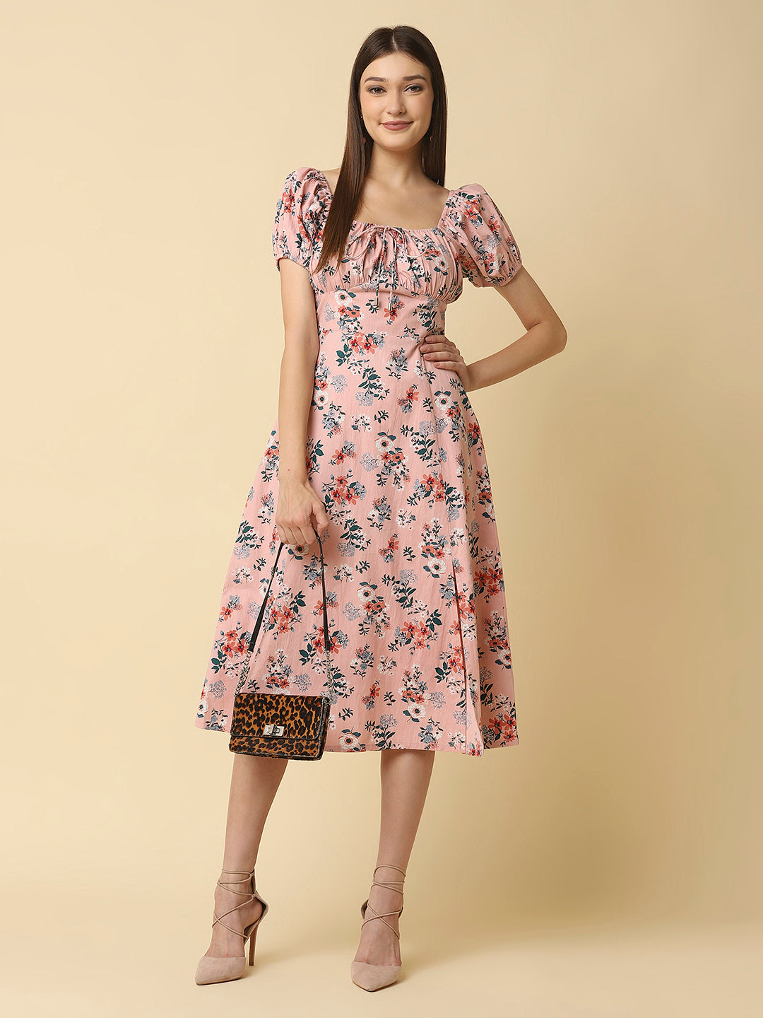 This Pink Floral Printed Women Dress In Cotton is a charming and elegant piece that is sure to catch the eye. Made from soft and breathable cotton fabric, it is perfect for warm weather and will keep you comfortable all day long. The dress features a beautiful floral print in shades of pink, white, and green that adds a pop of color to your wardrobe.