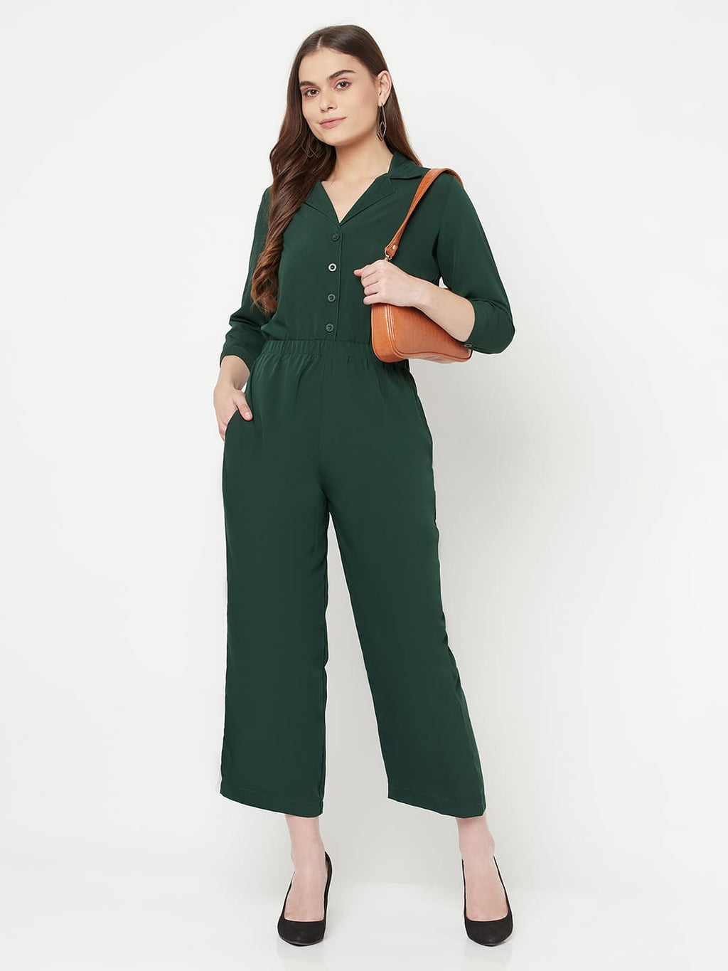 This Green color solid jump suit for women with an elasticated waist is a versatile and stylish piece of clothing that can be dressed up or down for any occasion. It is made of a comfortable and stretchy material that allows for ease of movement, while the elasticated waistband helps to flatter the figure and create a flattering silhouette.