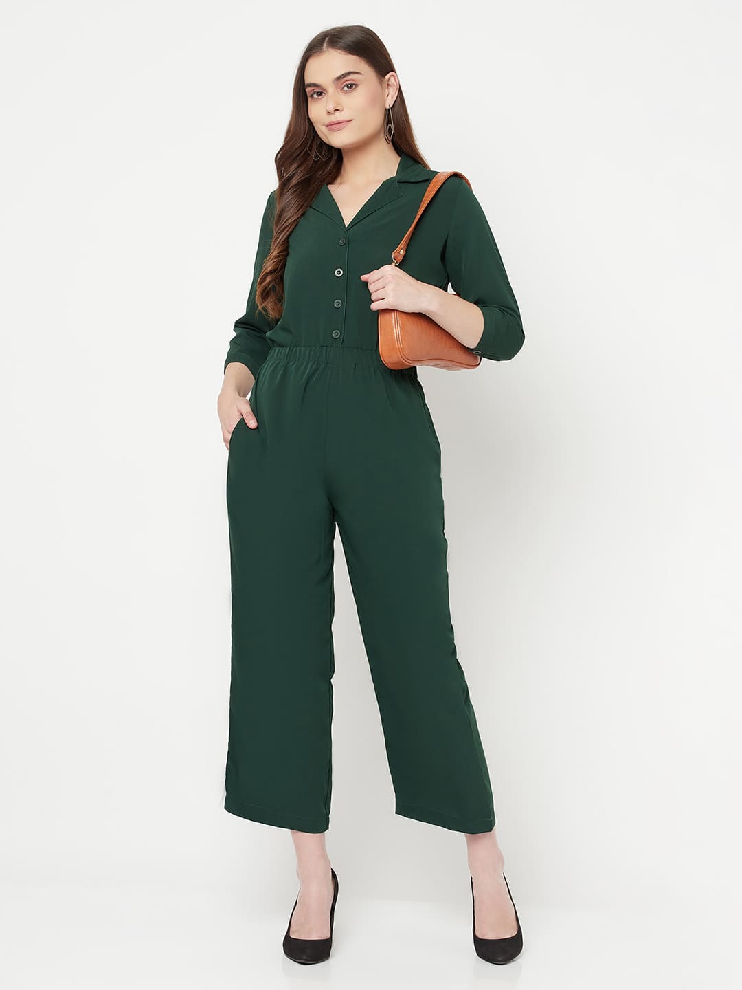 This Green color solid jump suit for women with an elasticated waist is a versatile and stylish piece of clothing that can be dressed up or down for any occasion. It is made of a comfortable and stretchy material that allows for ease of movement, while the elasticated waistband helps to flatter the figure and create a flattering silhouette.