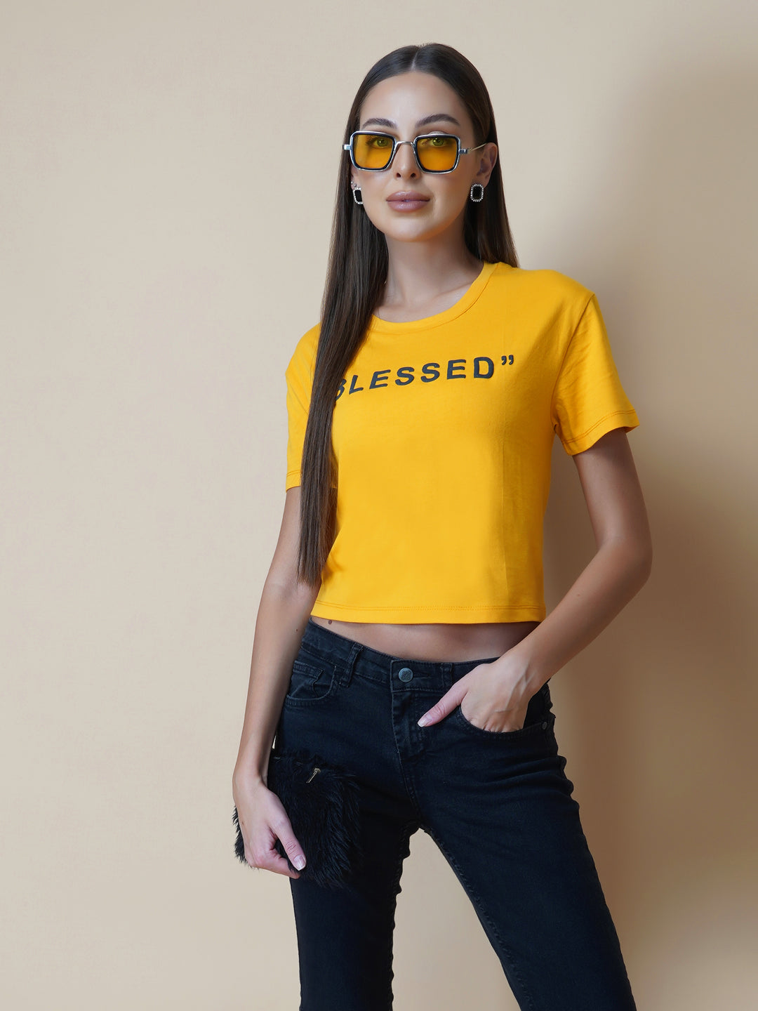 This women's t-shirt features a vibrant yellow color, making it perfect for adding a pop of brightness to any outfit. The T-shirt is made from a soft, comfortable fabric that is perfect for everyday wear. The design features a classic round neckline and short sleeves, making it ideal for warmer weather.  The front of the t-shirt features a stylish quotation in bold black letters, adding a touch of personality to the garment.