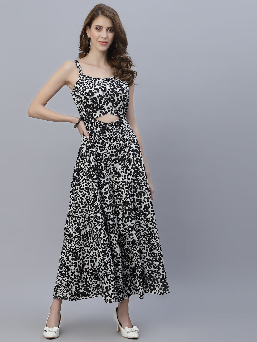 The Black Leopard Printed Fit and Flare Jumpsuit for Women is the perfect addition to any fashion-forward wardrobe. This jumpsuit features a bold and eye-catching leopard print, giving it an edgy and stylish look. The black color of the jumpsuit provides a timeless and versatile aesthetic, making it easy to dress up or down for any occasion.  The fit and flare design of the jumpsuit is incredibly flattering, accentuating curves in all the right places. 