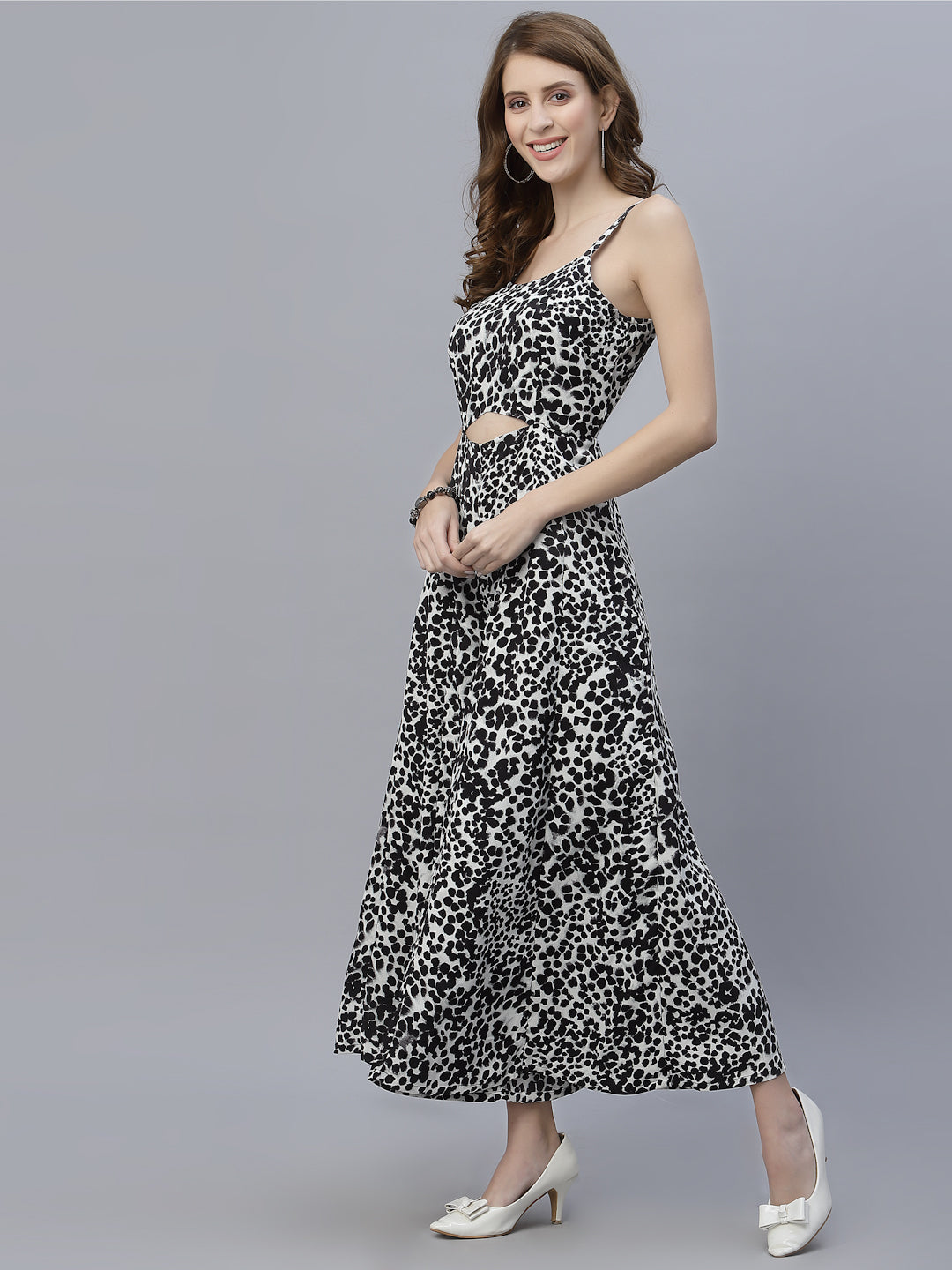 The Black Leopard Printed Fit and Flare Jumpsuit for Women is the perfect addition to any fashion-forward wardrobe. This jumpsuit features a bold and eye-catching leopard print, giving it an edgy and stylish look. The black color of the jumpsuit provides a timeless and versatile aesthetic, making it easy to dress up or down for any occasion.  The fit and flare design of the jumpsuit is incredibly flattering, accentuating curves in all the right places. 