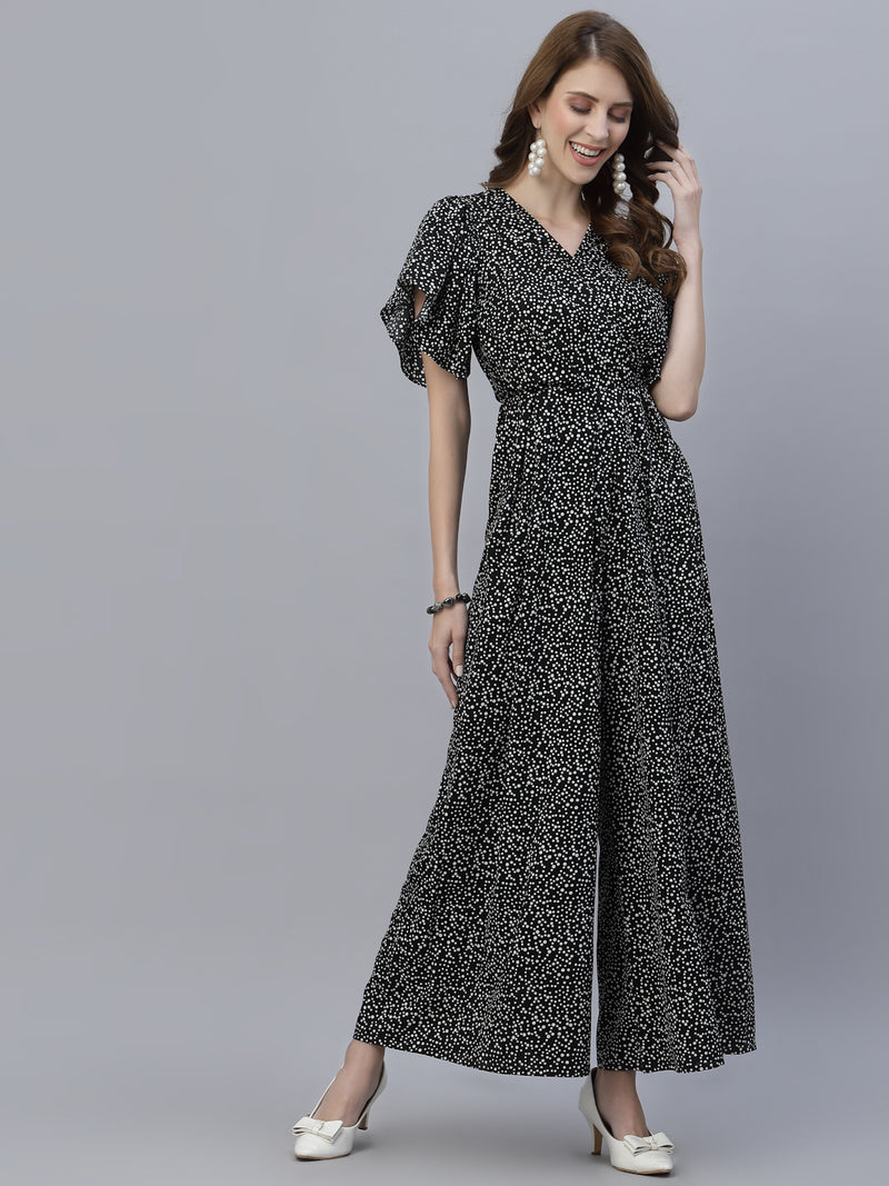 The Black Dot Printed Fit and Flare Jumpsuit for women is a stylish and versatile outfit that is perfect for any occasion. This women jumpsuit is designed to fit and flatter the female form, with a fitted waist that cinches in to create a flattering silhouette. The black and white polka dot print adds a playful touch to this chic jumpsuit for women, making it perfect for both casual and formal events.