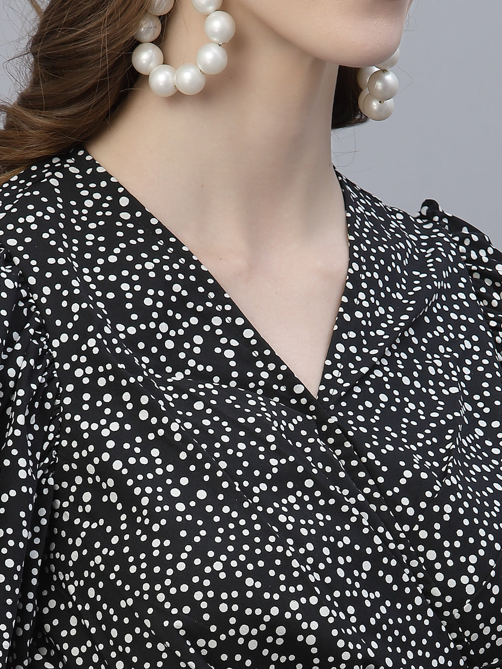 The Black Dot Printed Fit and Flare Jumpsuit for women is a stylish and versatile outfit that is perfect for any occasion. This women jumpsuit is designed to fit and flatter the female form, with a fitted waist that cinches in to create a flattering silhouette. The black and white polka dot print adds a playful touch to this chic jumpsuit for women, making it perfect for both casual and formal events.